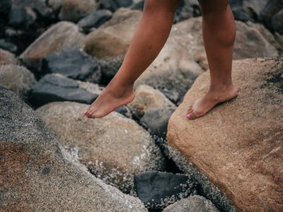 Close-up of feet on a mat, showing balance and stability.