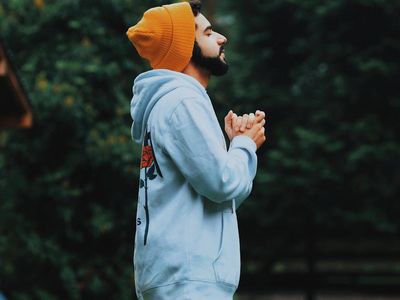 Side profile of a person taking a deep breath with eyes closed.